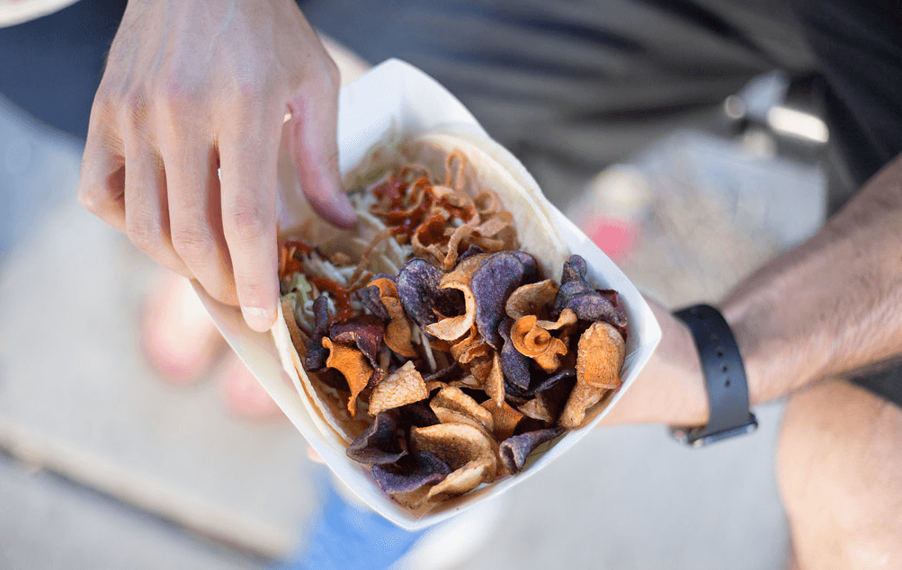 Employee enjoying office lunch from a food truck program